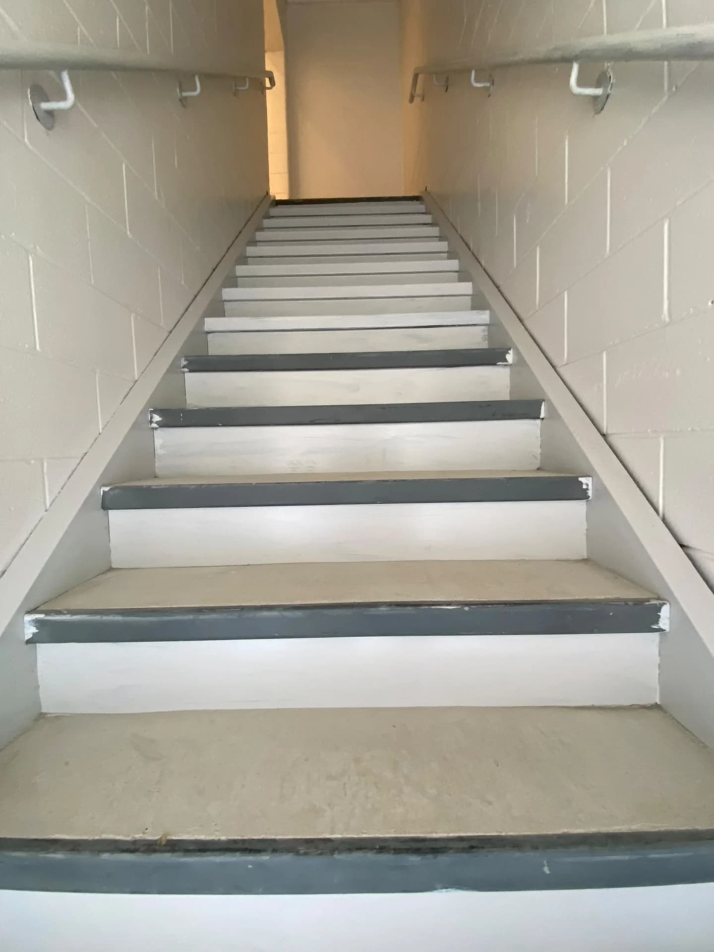 After wall painting: light stairwell walls with stair finishing still in progress